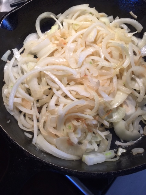 Caramelizing onions in Val's grandma's cast iron skillet 
